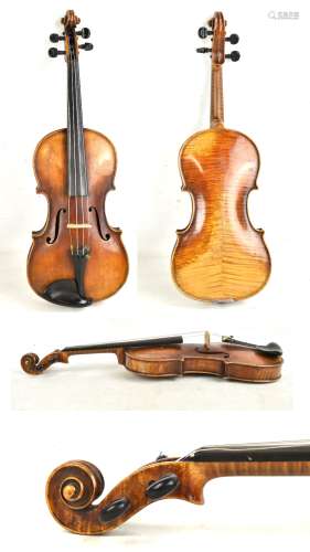 A full size German violin with two-piece back, length 35.7cm, bearing spurious Caspar di Salo label,