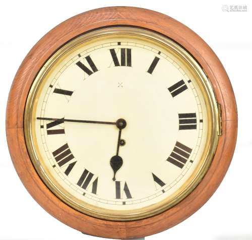 A late 19th/early 20th century oak cased wall clock, the circular dial with Roman numerals, diameter