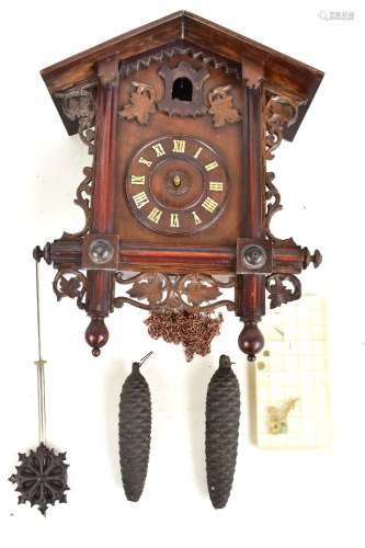 An early 20th century Black Forest cuckoo clock, the circular dial set with Roman numerals, height