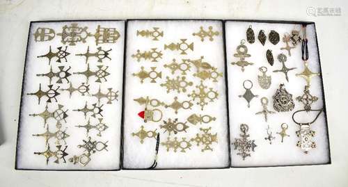 A quantity of African tribal white metal pendants including some Tuareg examples.Additional