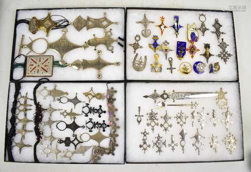 A quantity of white metal and other African tribal jewellery including rings, enameled brooches