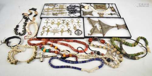 A quantity of African tribal jewellery including pendants, other carved pendants, bead work
