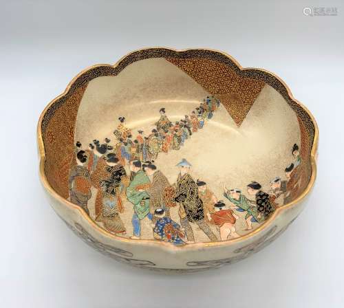 A Japanese Meiji period Satsuma bowl with shaped rim and interior decoration of a procession, the