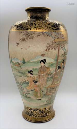 A very large Japanese Meiji period Satsuma vase, the twin panels both decorated with figures in a