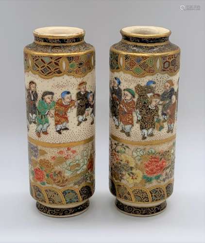 A pair of Japanese Meiji period Satsuma cylindrical vases each decorated with a band of children