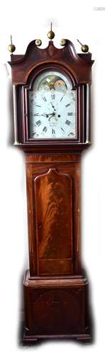 An early 19th century mahogany and inlaid longcase cclock with repainted arch dial set with