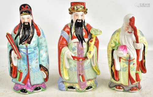 Three Chinese porcelain figures depicting the three gods 'Feng Shui, Fuk Luk, Sau Statu', each