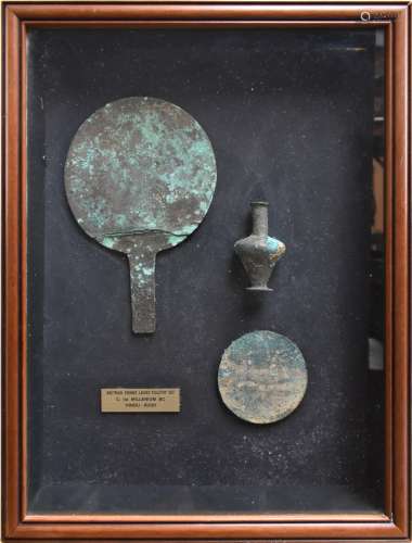 A framed and glazed display of a first millennium BC Hindu-Kush Bactrian bronze lady's toiletry set,