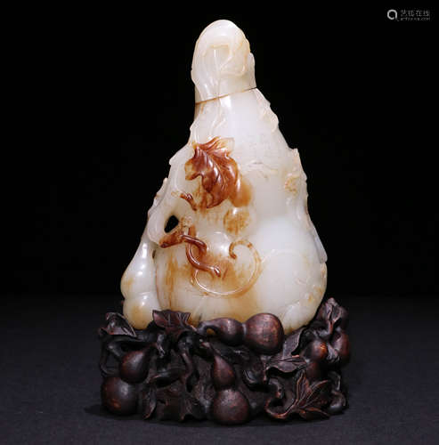 A Qing Dynasty Carved Hetian Jade Ornament, Gourd