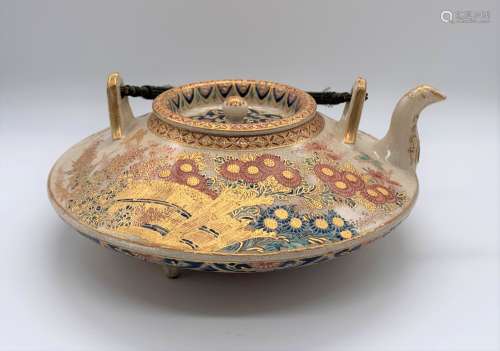 A Japanese Meiji period Imperial Palette Satsuma squat teapot painted with floral sprays and