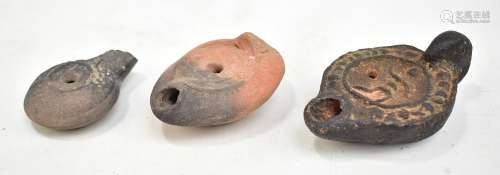 A group of three Roman pottery lamps, the largest length 10.5cm.Additional InformationThe largest is
