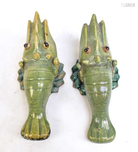 An unusual pair of Chinese celadon glazed wall pockets modelled as crayfish, unmarked, length