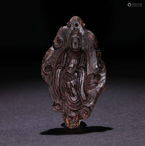 A Qing Dynasty Carved Agarwood Guanyin Pendant