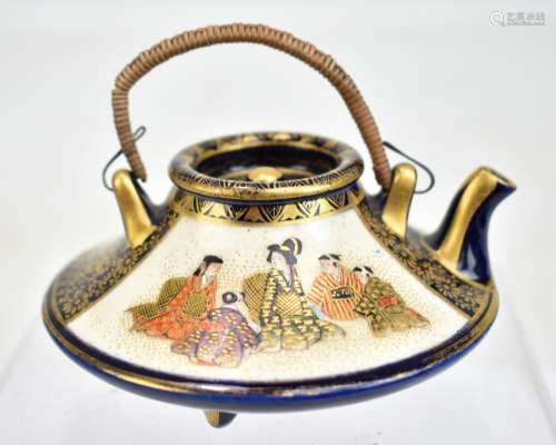 An early 20th century Japanese porcelain Satsuma miniature kyushu or hot water pot with gilt and
