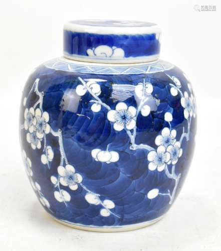 A late 19th/early 20th century Chinese porcelain ginger jar and cover decorated with prunus, bearing