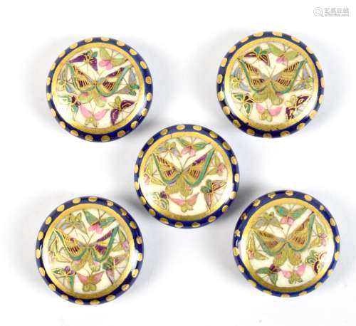 A set of five early 20th century Japanese Satsuma buttons decorated with butterflies.