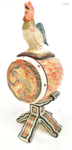 A Japanese Meiji period Satsuma koro in the form of a drum on a stand, the cover with cockerel