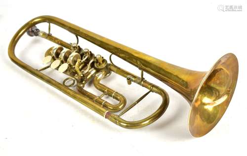 A brass rotary trumpet by Aug. Clemens Glier, Markneukirchen, cased.