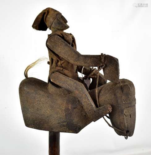 An early 20th century south Sulewasi Indonesian carved wooden figure of a horse and rider, height