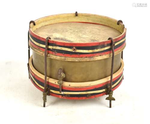 An early 20th century brass and wooden painted circular drum with red, white and blue upper and