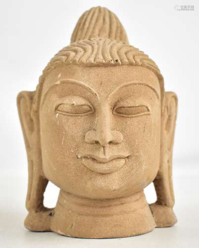 An Indonesian volcanic stone head of Buddha, height 20cm. Provenance: From a private collection in