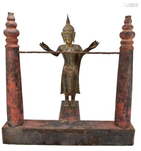 A 19th century or earlier Burmese gilded and carved wooden figure of Buddha, ex-temple, mounted on a