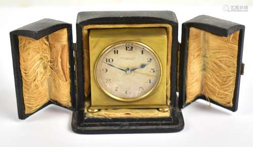 ZENITH WATCH COMPANY; a 19th century brass cased travelling alarm clock, the circular dial set