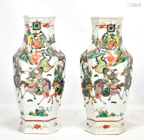 A pair of Chinese porcelain wucai Famille Verte vases with panelled decoration depicting warriors on