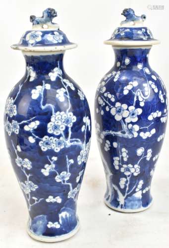 A pair of late 19th/early 20th century Chinese blue and white porcelain lidded vases decorated
