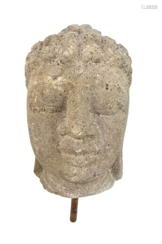 A large Javanese carved volcanic rock bust of Buddha, height 36cm, now with drilled section of
