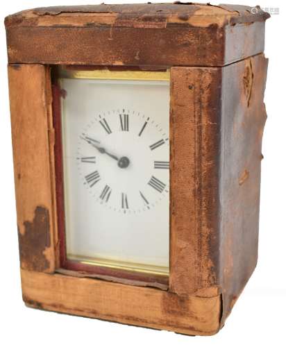A late 19th century French brass cased repeating carriage clock, the enamel dial set with Roman