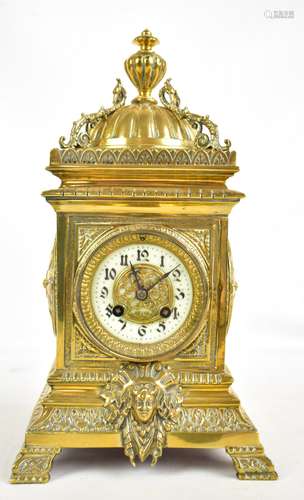 A late 19th century French brass cased mantel clock, the circular porcelain dial painted with Arabic