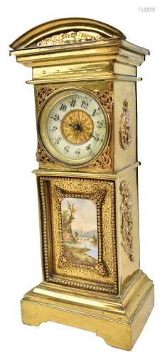 A brass cased timepiece in the form of a longcase clock, the circular porcelain dial set with Arabic