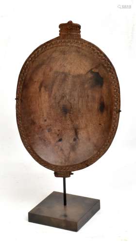 A Papua New Guinea Massim shallow bowl with outer band of incised decoration, mounted on a stand,