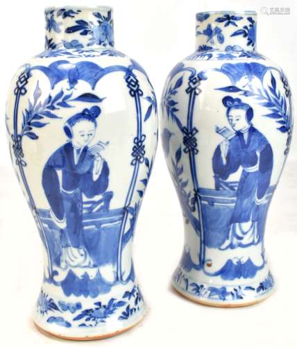 A pair of Chinese blue and white porcelain vases, painted with figures and exotic birds in landscape