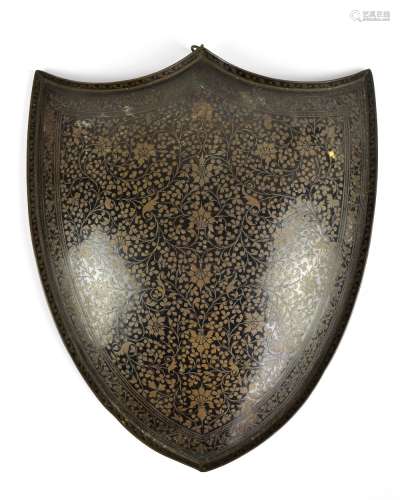 An early 20th century Indian lacquered copper decorative wall hanging plaque modelled as a shield,