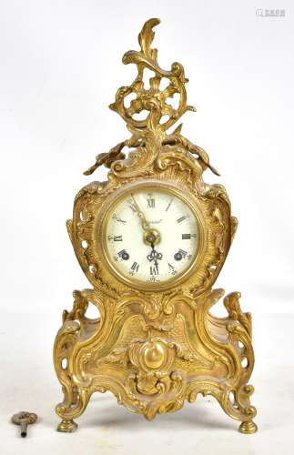 IMPERIAL; a reproduction gilt metal mantel clock, with pierced ornate decoration throughout, with