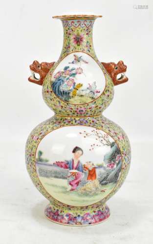 A Chinese porcelain double gourd vase with four circular panels depicting figures and birds in
