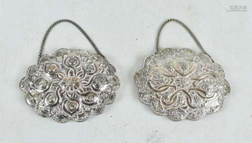Two Turkish silver framed mirrors with repoussé detail and crimped rims, one marked '900 Felo' to
