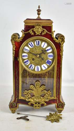 An early to mid 20th Century French boulle work mantel clock, the circular dial set with applied