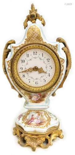 An early 20th century French porcelain hand painted clock, with gilt metal mount surrounding hand