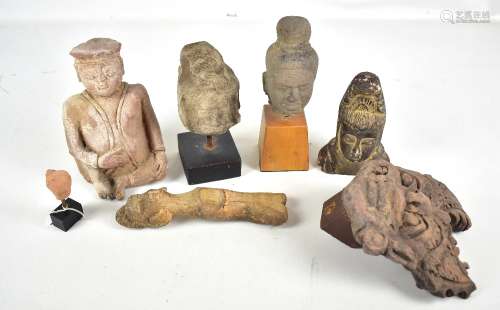 A small group of ancient Southeast Asian carvings and fragments including a Quan Yin (Guanyin)
