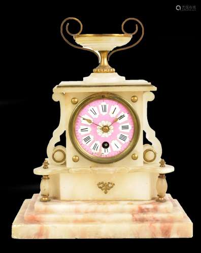 A French alabaster mantel clock with urn surmount above pink enamelled dial set with Roman numerals,