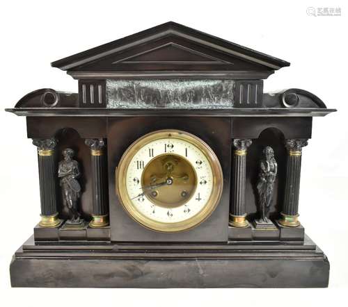 A D MOUGIN; a late 19th century French black slate mantel clock of architectural form featuring