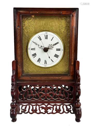 A circa 1900 Chinese rosewood cased mantel clock, the white enamel dial set with Roman numerals,