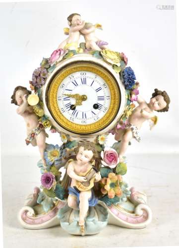 A late 19th century Continental porcelain floral encrusted mantel clock, the circular enamelled dial