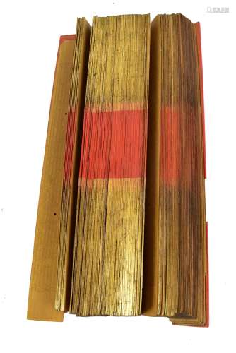 A 19th century Burmese palm leaf prayer manuscript with gilt and red edges and red lacquered outer