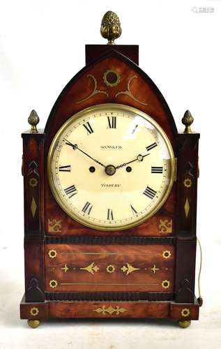 OSMOND OF TISBURY; a Regency mahogany brass inlaid lancet top mantel clock, the circular dial with