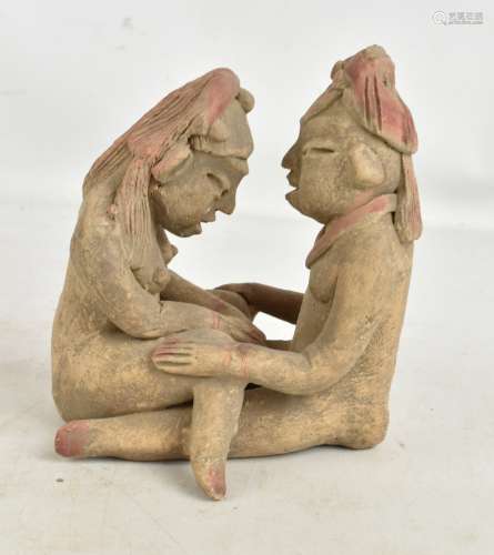 A pre-Columbian type erotic figure group with coloured detail, height 18cm (af). Additional