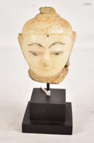 An 18th century Burmese carved alabaster fragmentary bust of the Buddha or a Bodhisattva, height